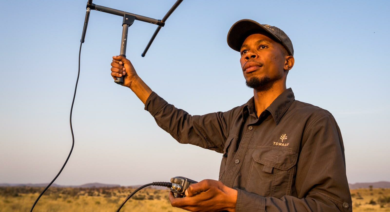 Clement climbs out of the vehicle to better track a cheetah